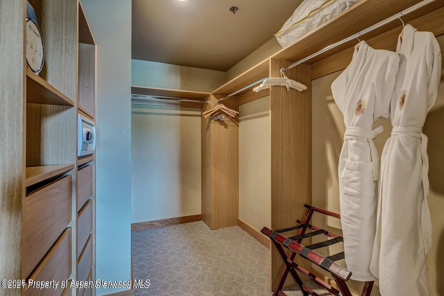 130 Wood Road, Unit 625 Snowmass Village, CO 81615 - Photo 8 of 15 a view of walk in closet with clothes