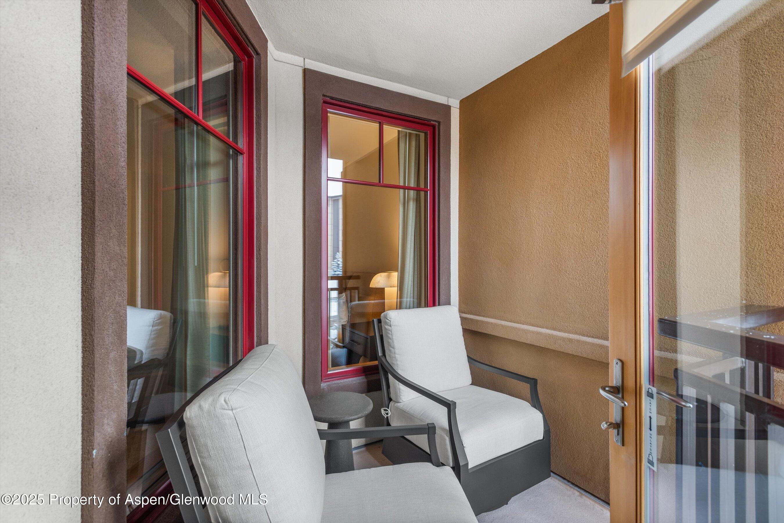 130 Wood Road, Unit 625 Snowmass Village, CO 81615 - Photo 9 of 15 a living room with furniture a window and a potted plant