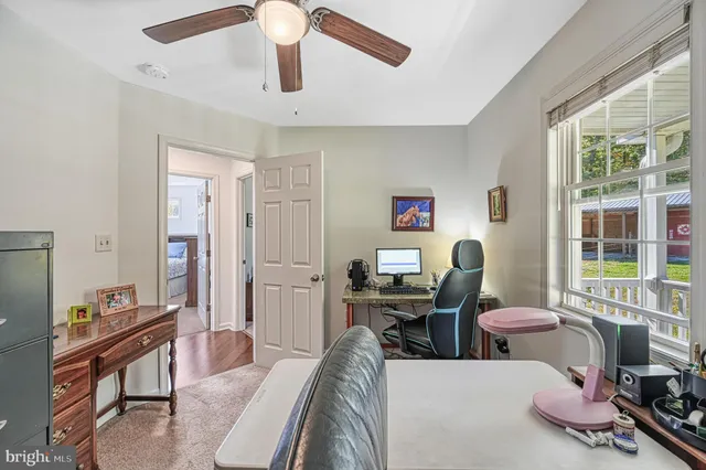 a work room with furniture and a window