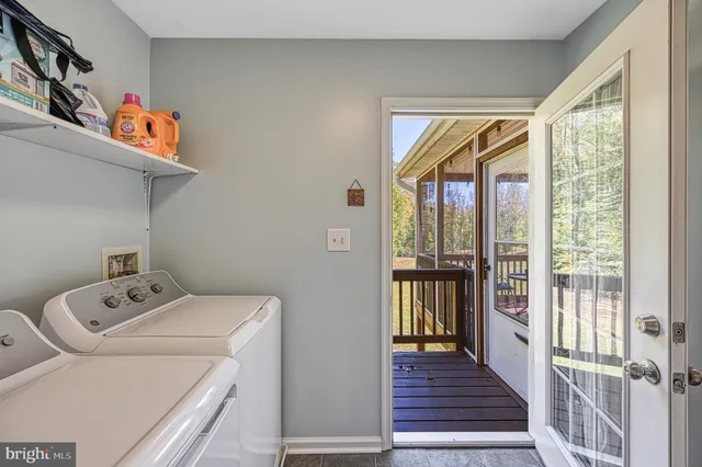 a bathroom with a sink and mirror with bathtub