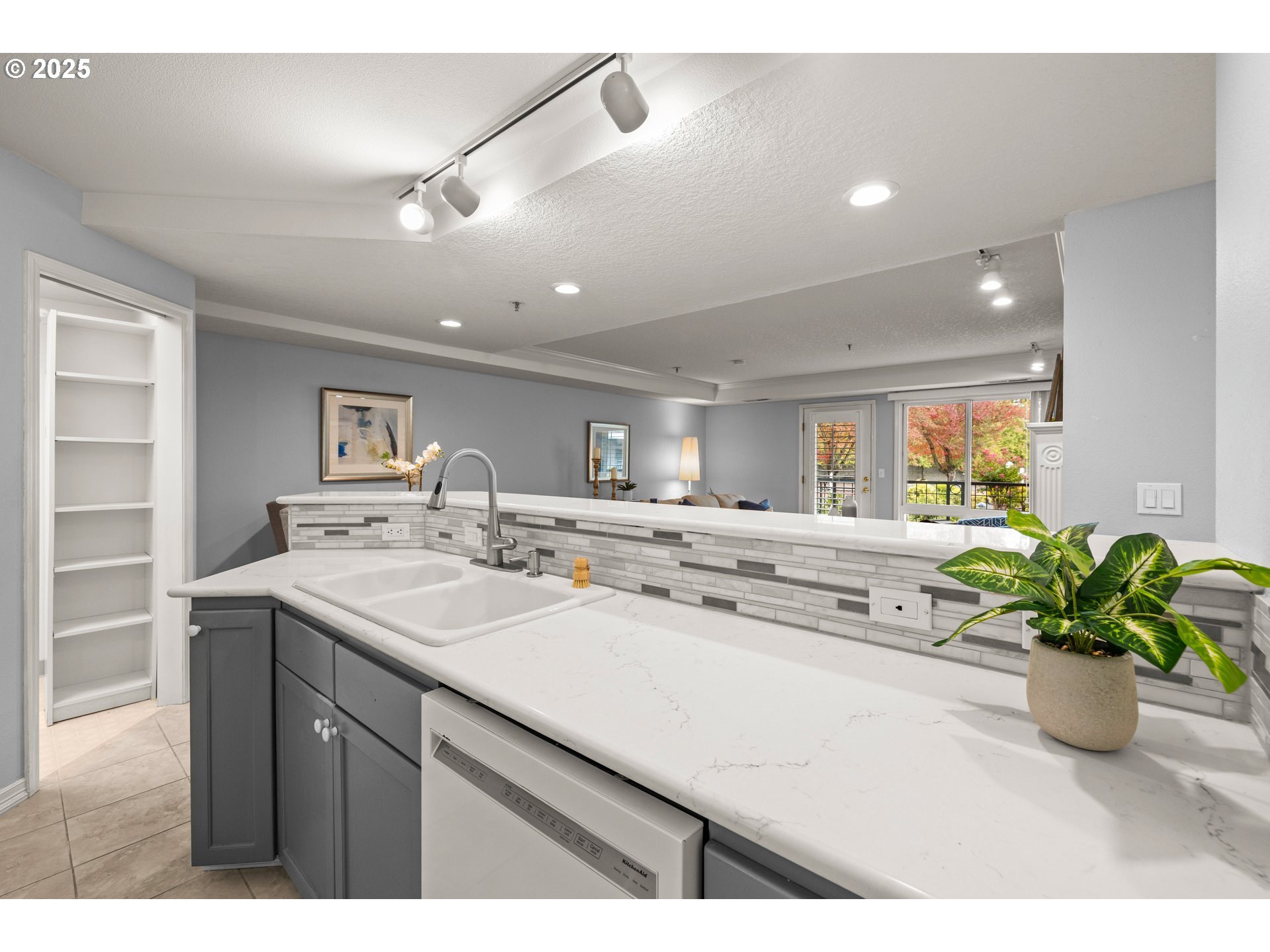 15420 Northeast Knott Street, Unit 2 Portland, OR 97230 - Photo 11 of 30 a kitchen with a sink and a potted plant