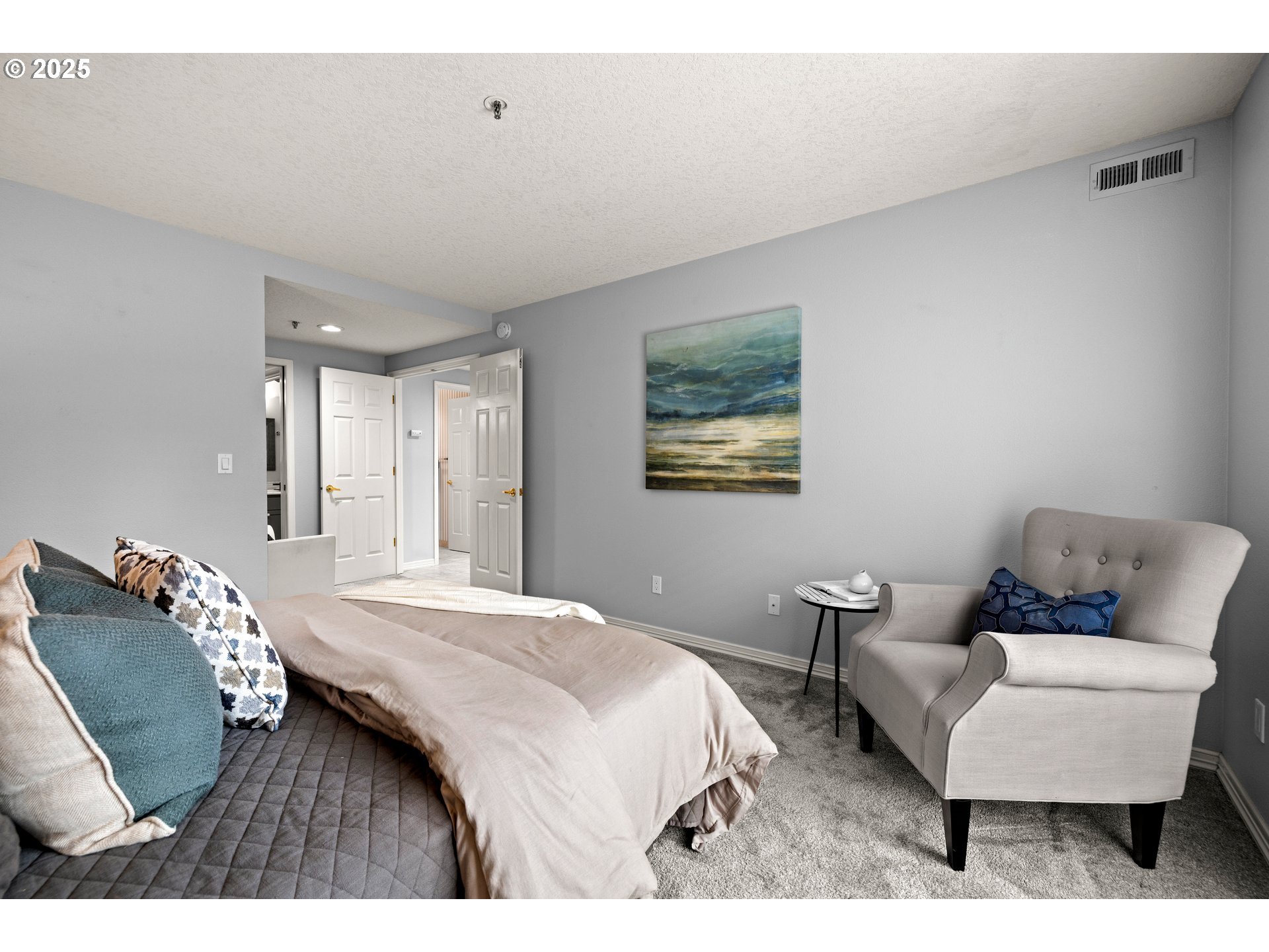 15420 Northeast Knott Street, Unit 2 Portland, OR 97230 - Photo 15 of 30 a bedroom with a bed and a couch