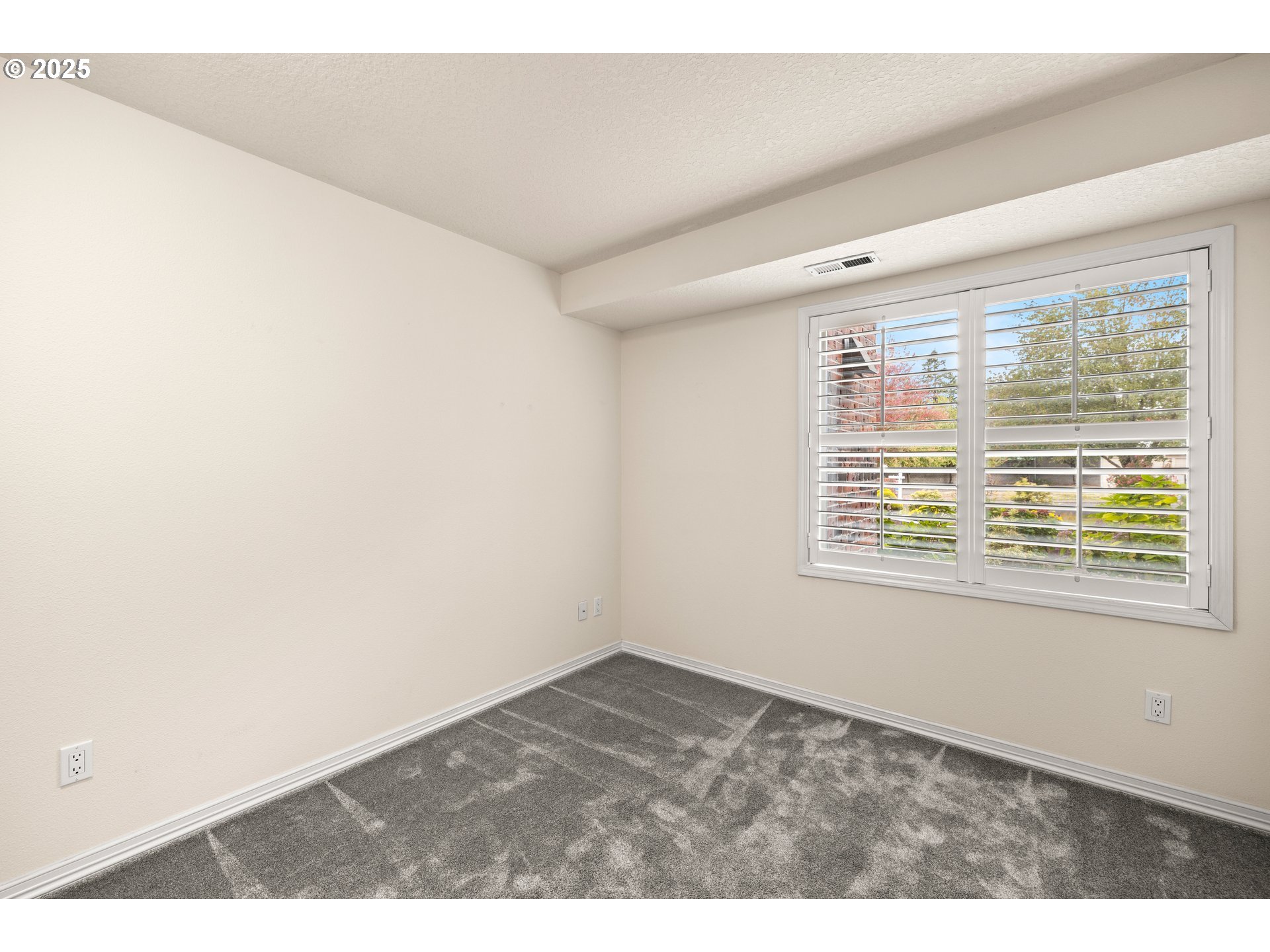 15420 Northeast Knott Street, Unit 2 Portland, OR 97230 - Photo 20 of 30 a view of an empty room with a window