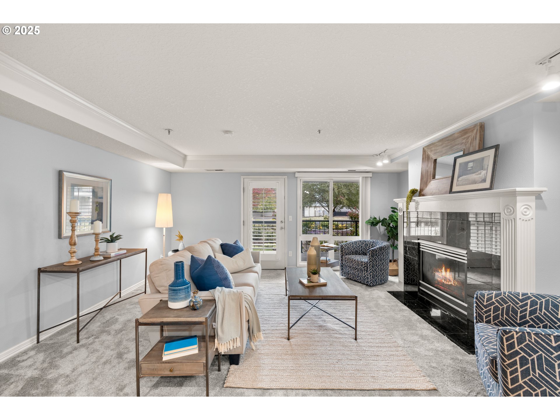 15420 Northeast Knott Street, Unit 2 Portland, OR 97230 - Photo 3 of 30 a living room with furniture a rug and a fireplace