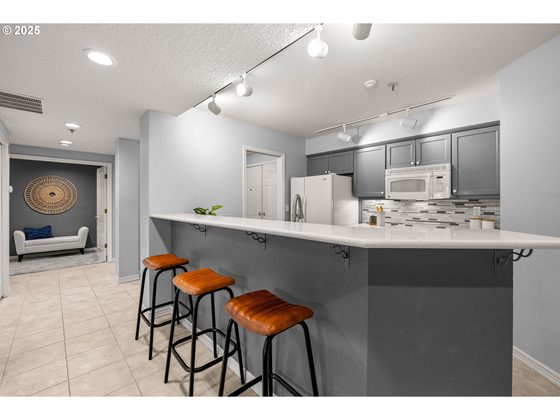 15420 Northeast Knott Street, Unit 2 Portland, OR 97230 - Photo 7 of 30 a kitchen with stainless steel appliances kitchen island granite countertop a sink and cabinets