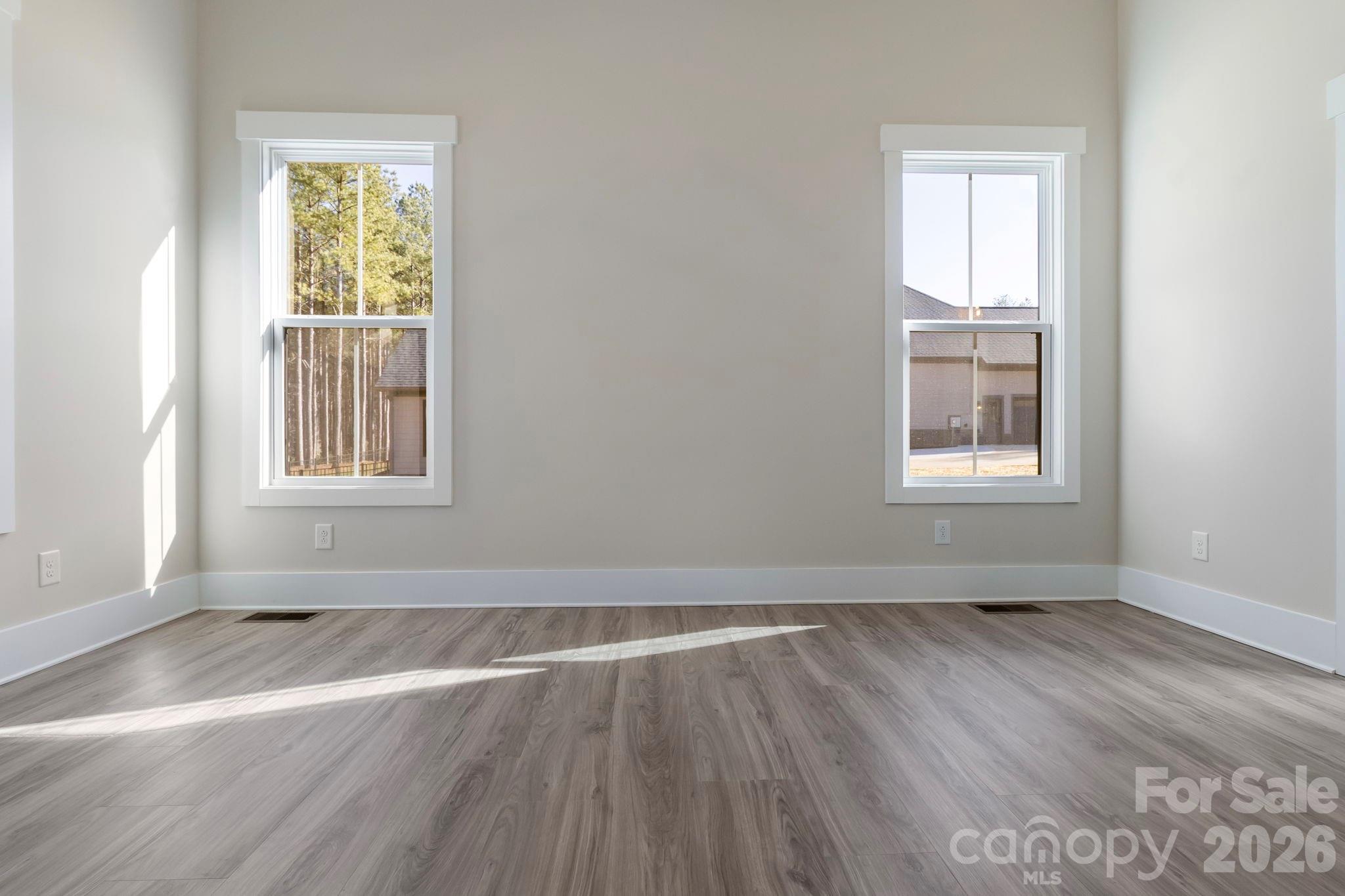 1359 Glasscock Road, Unit 1 Rock Hill, SC 29730 - Photo 19 of 40 an empty room with wooden floor and windows