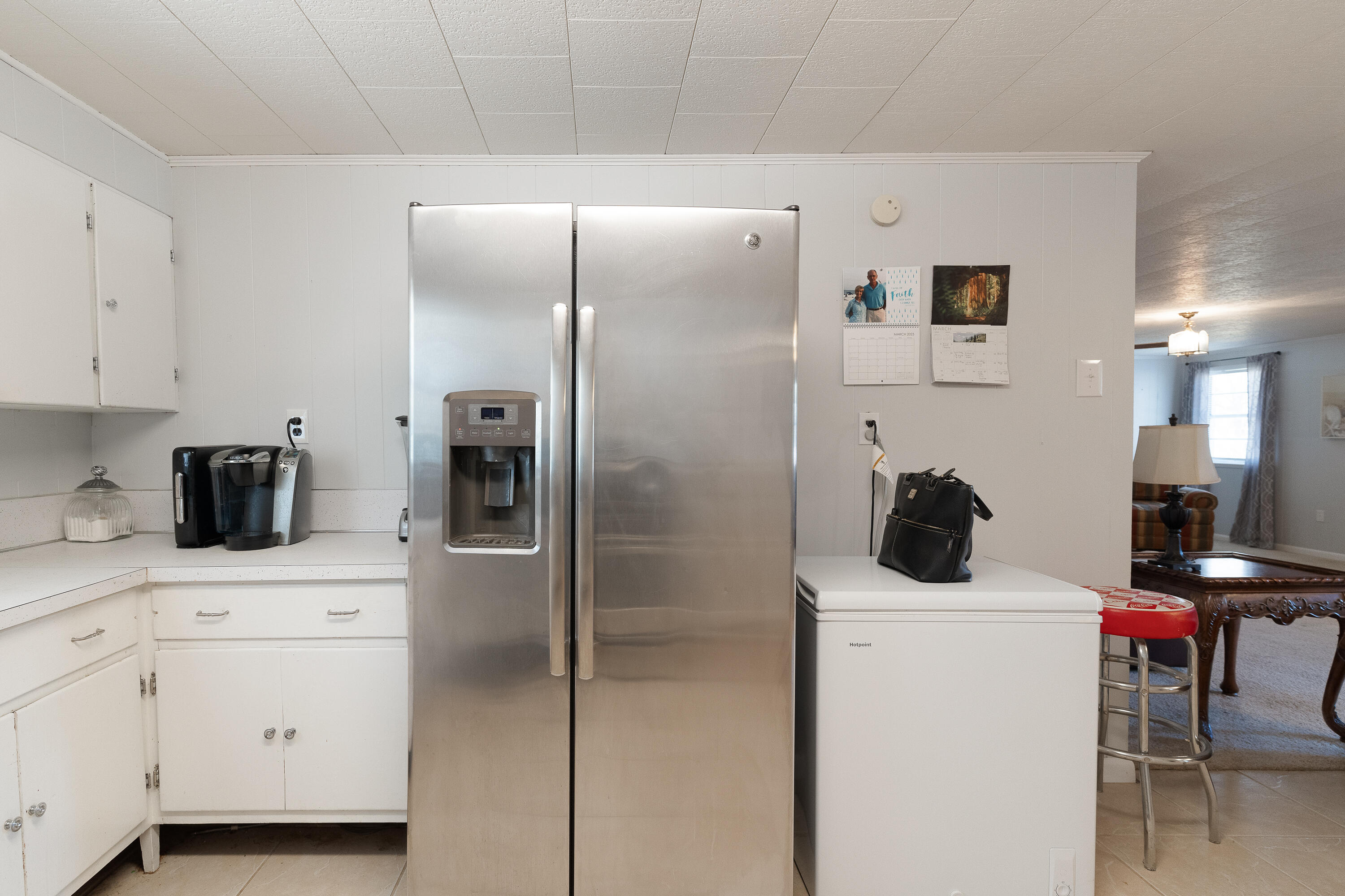 5686 Griffith Cemetery Road Baker, FL 32531 - Photo 15 of 52 a kitchen with a refrigerator and cabinets