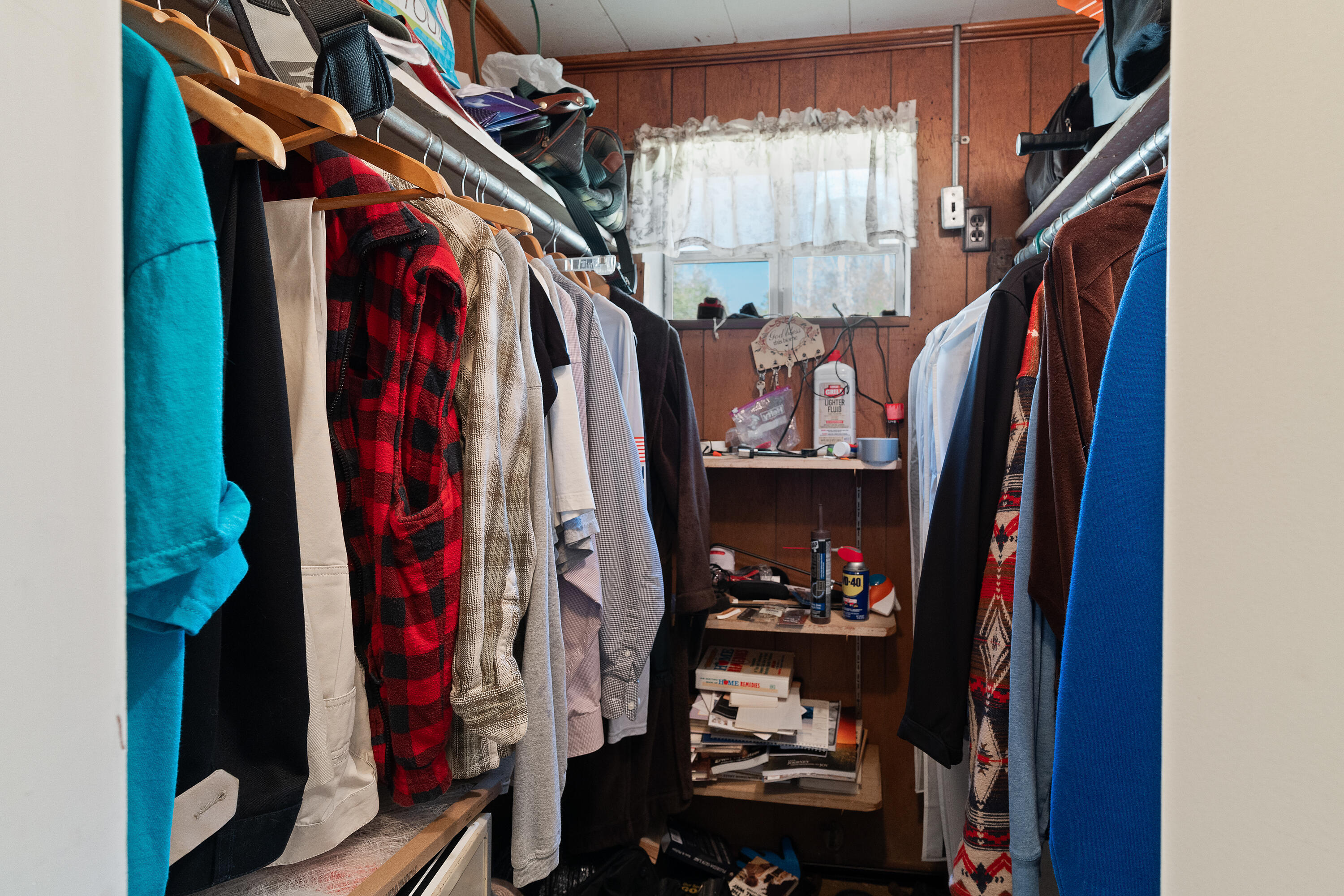 5686 Griffith Cemetery Road Baker, FL 32531 - Photo 20 of 52 a view of walk in closet with clothes and shoes