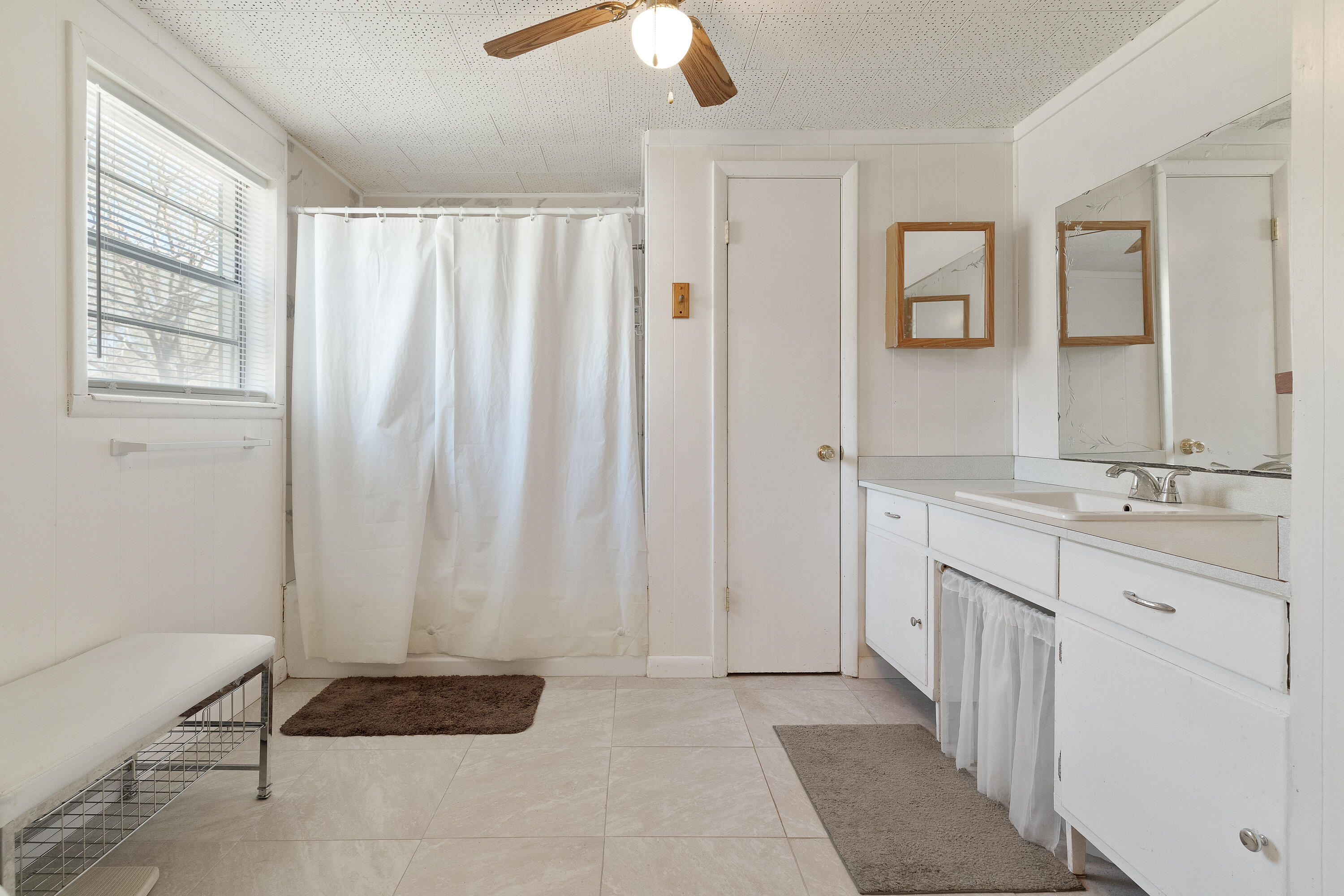 5686 Griffith Cemetery Road Baker, FL 32531 - Photo 21 of 52 a bathroom with a double vanity sink and a mirror