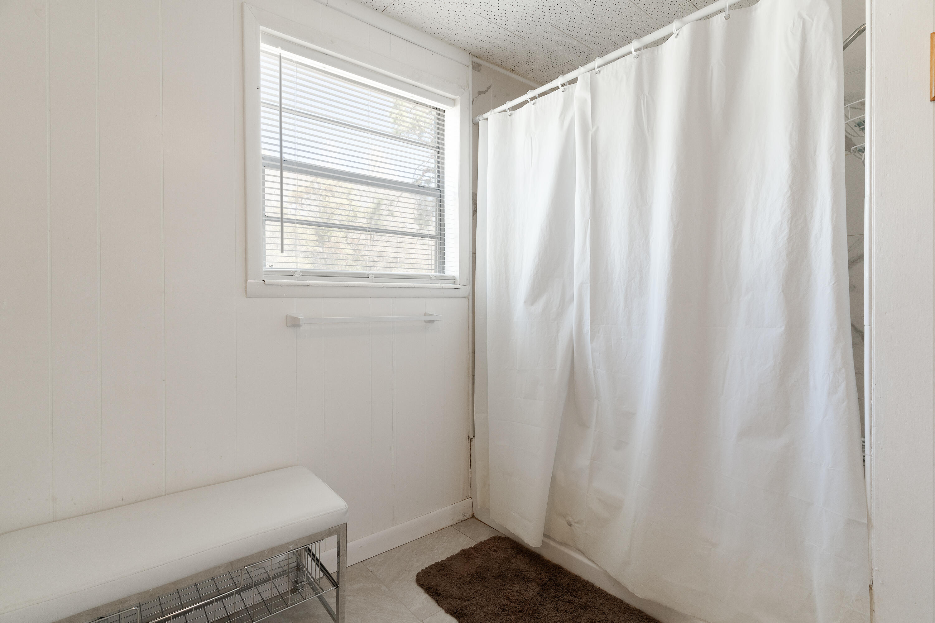 5686 Griffith Cemetery Road Baker, FL 32531 - Photo 23 of 52 a bathroom with a toilet and a shower curtain