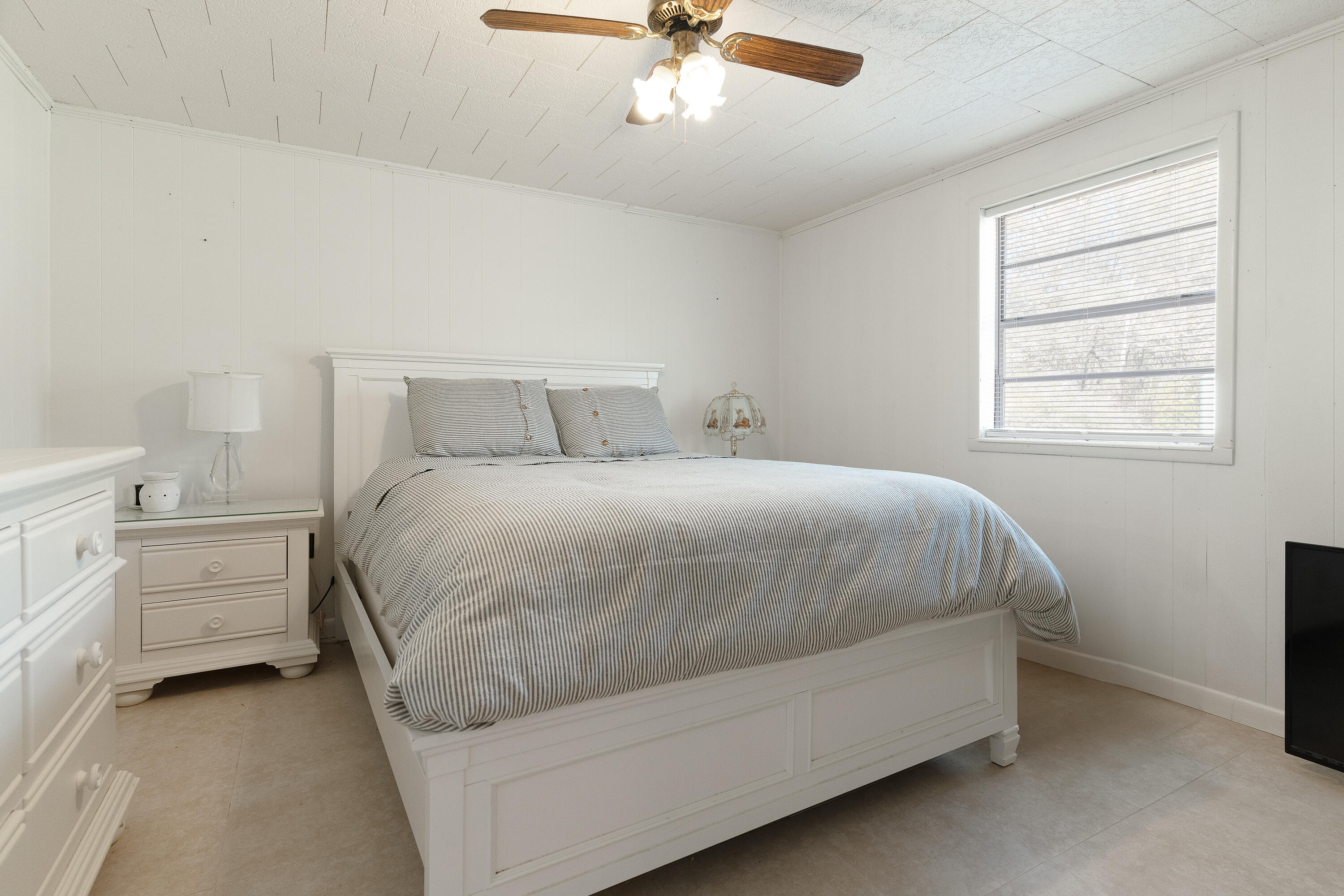 5686 Griffith Cemetery Road Baker, FL 32531 - Photo 25 of 52 a bedroom with a bed and a chandelier