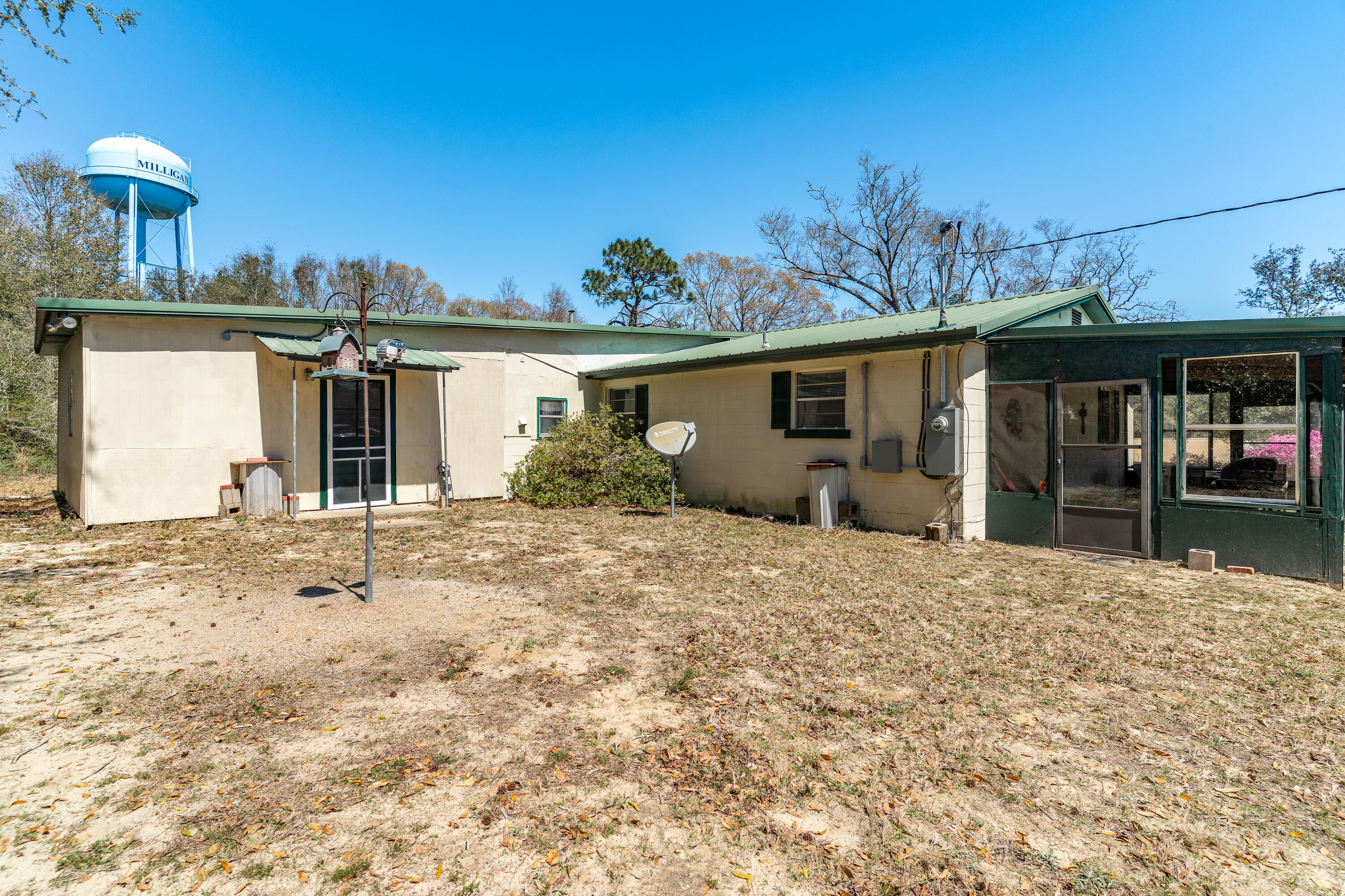 5686 Griffith Cemetery Road Baker, FL 32531 - Photo 29 of 52 a front view of a house with garden
