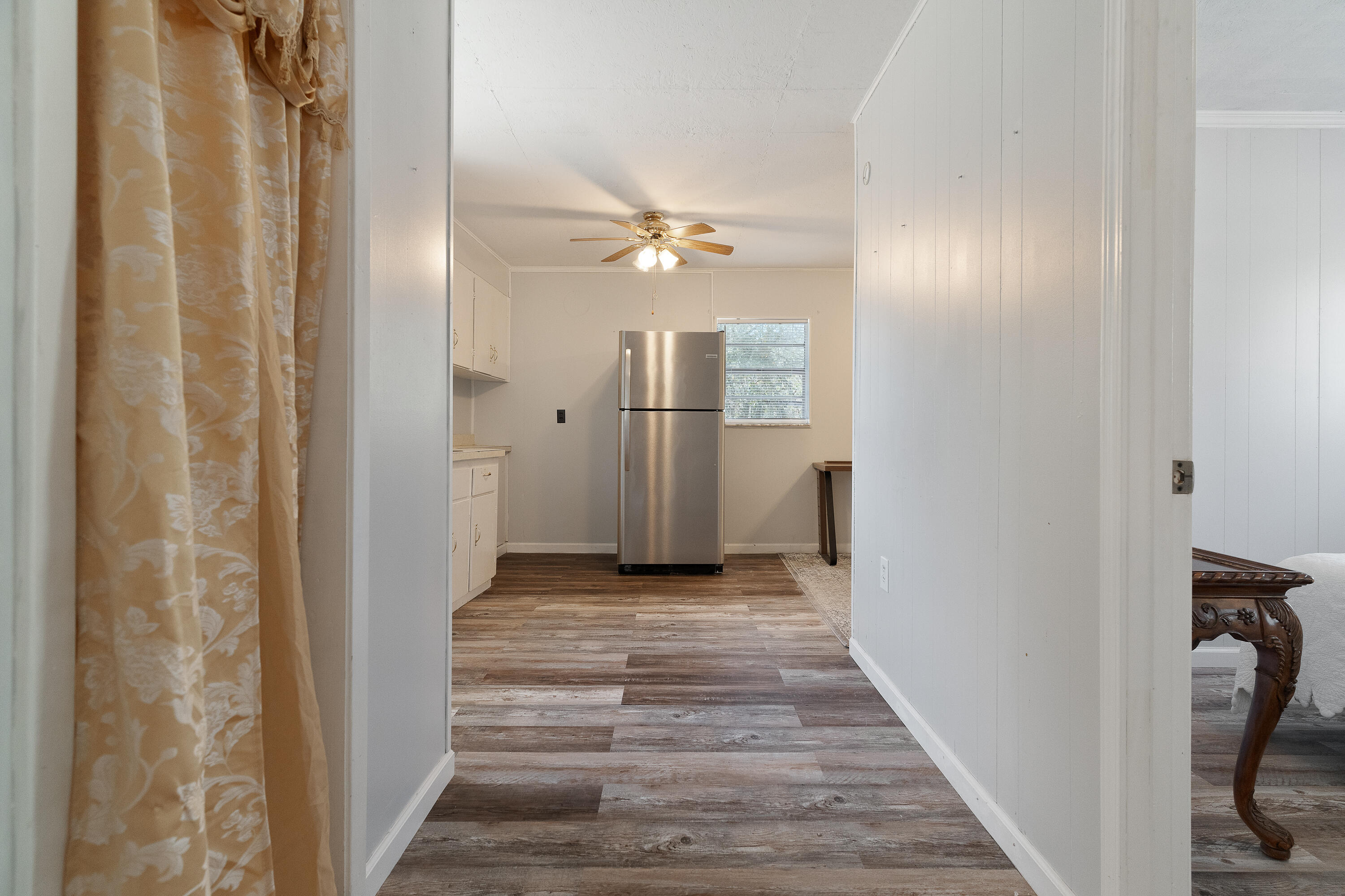 5686 Griffith Cemetery Road Baker, FL 32531 - Photo 34 of 52 a view of a hallway with wooden floor