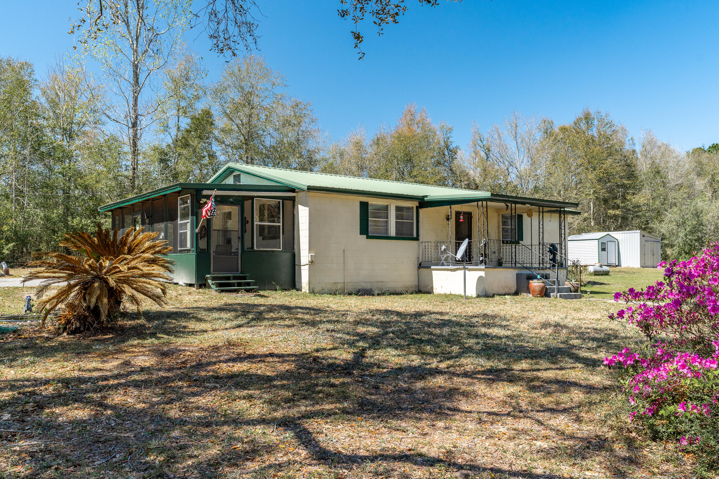 5686 Griffith Cemetery Road Baker, FL 32531 - Photo 42 of 52 a view of a house with backyard and sitting area
