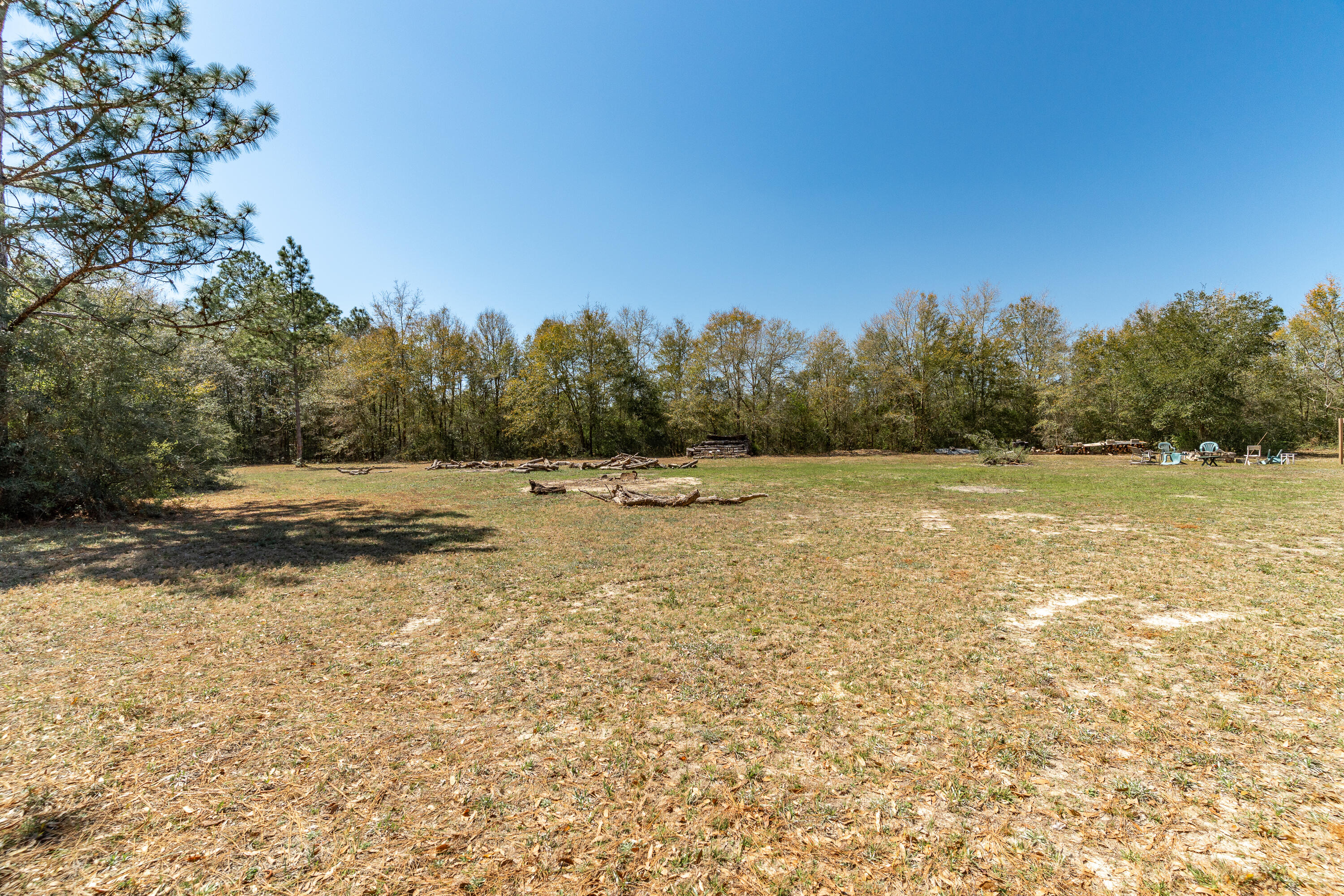 5686 Griffith Cemetery Road Baker, FL 32531 - Photo 48 of 52 a view of a field with trees in the background