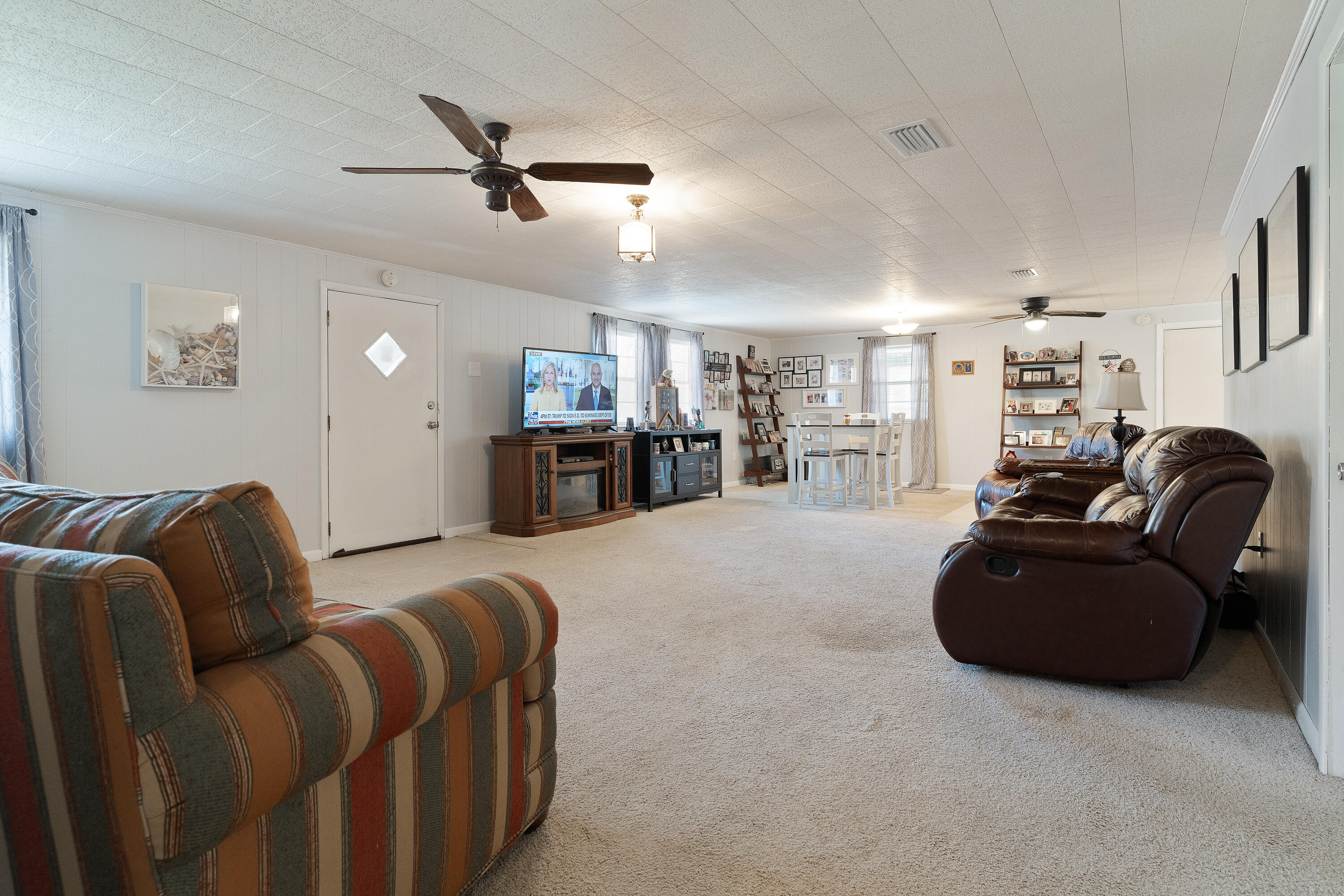 5686 Griffith Cemetery Road Baker, FL 32531 - Photo 9 of 52 a living room with furniture and kitchen view