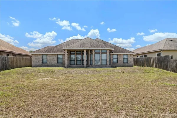 a house with swimming pool in front of it