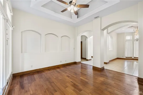 a view of an entryway with wooden floor