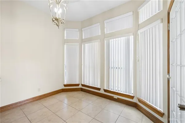 a view of a room with a window and a mirror