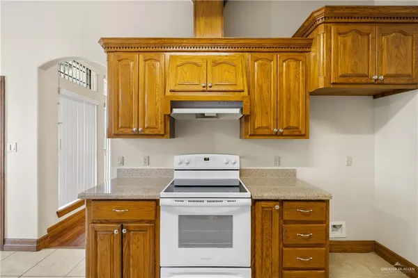 a kitchen with stainless steel appliances granite countertop a stove and a microwave