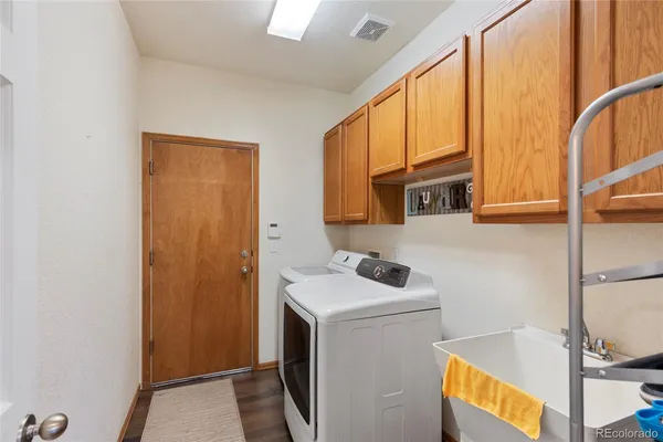 a utility room with dryer and washer