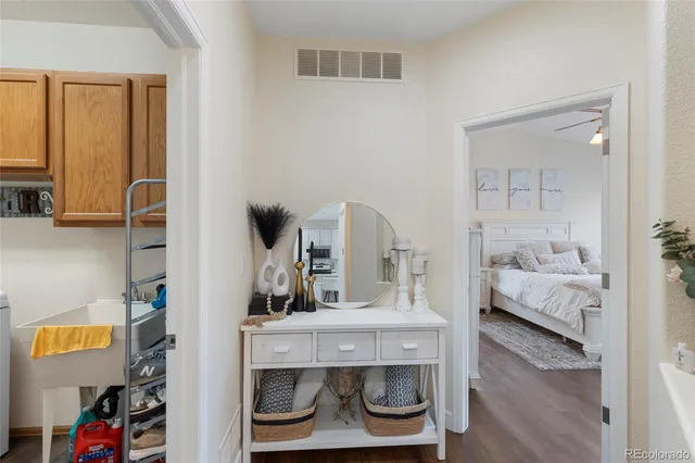 a bedroom with a bed and a mirror