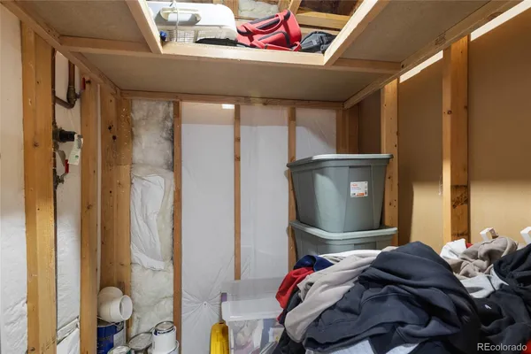 a bedroom with a bed and a mirror