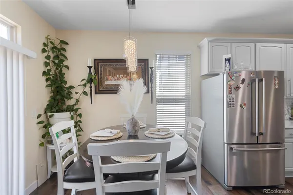 a view of a dining room with furniture and window