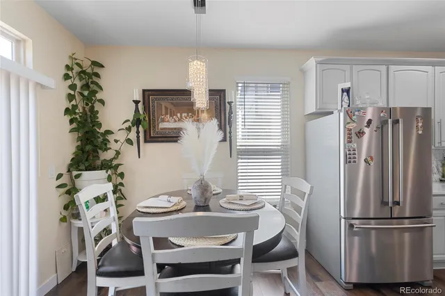 a view of a dining room with furniture and window