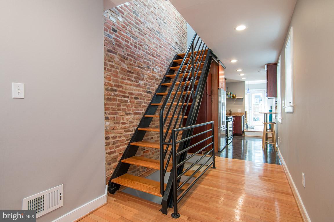 512 South Rose Street Baltimore, MD 21224 - Photo 16 of 30 a view of entryway and hall with wooden floor