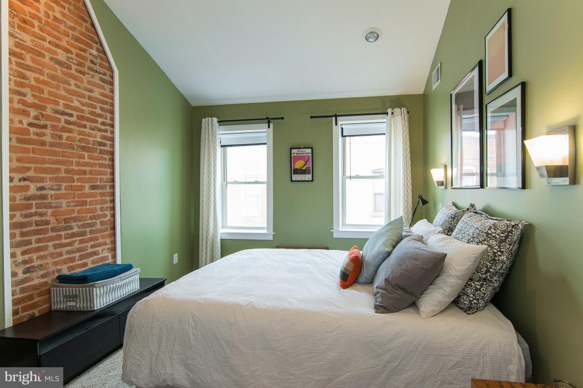 512 South Rose Street Baltimore, MD 21224 - Photo 19 of 30 a bedroom with a bed and a window