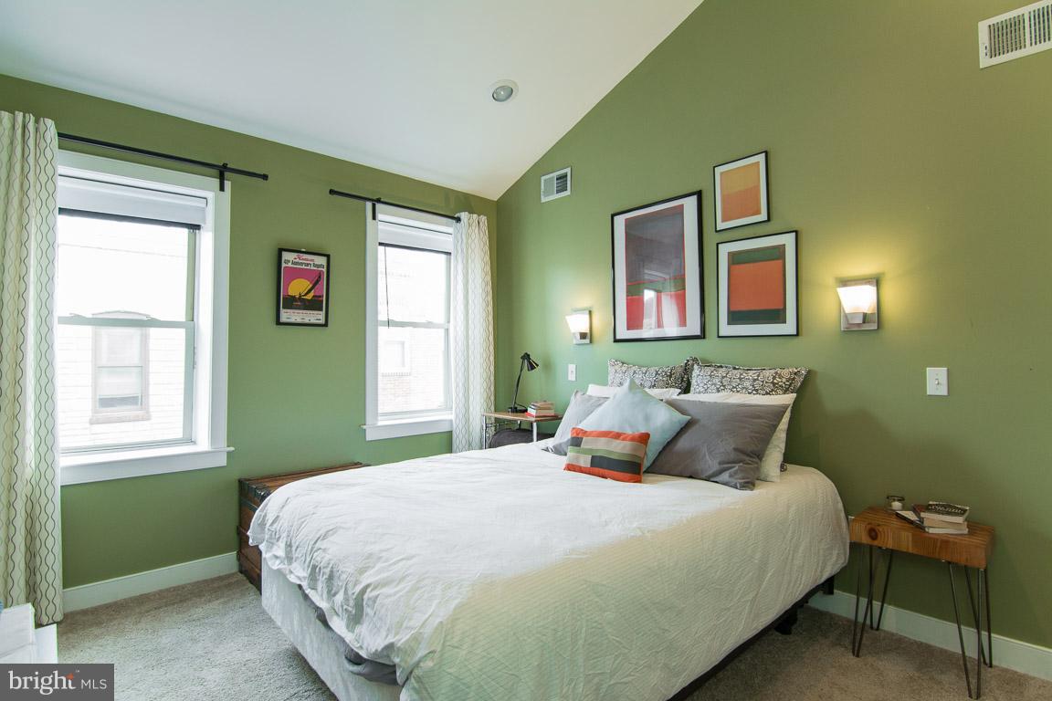 512 South Rose Street Baltimore, MD 21224 - Photo 21 of 30 a bedroom with a bed and windows