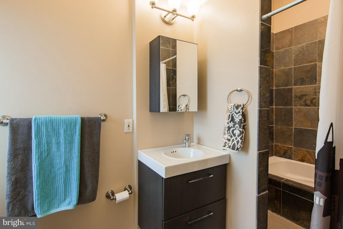 512 South Rose Street Baltimore, MD 21224 - Photo 22 of 30 a bathroom with a sink and a mirror