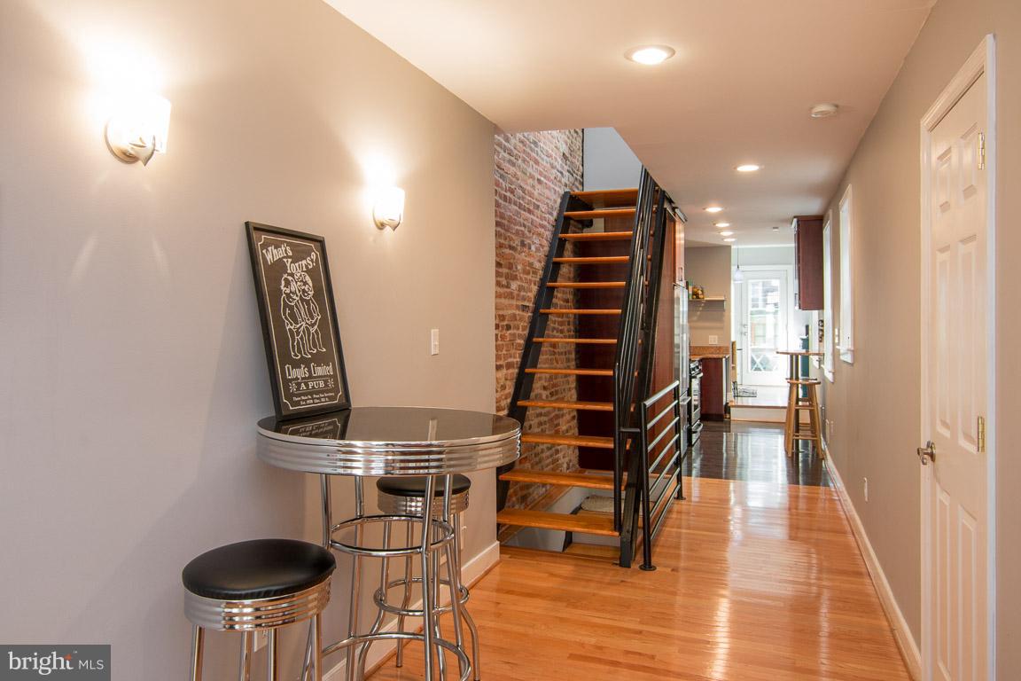 512 South Rose Street Baltimore, MD 21224 - Photo 5 of 30 a view of entryway and hall with wooden floor