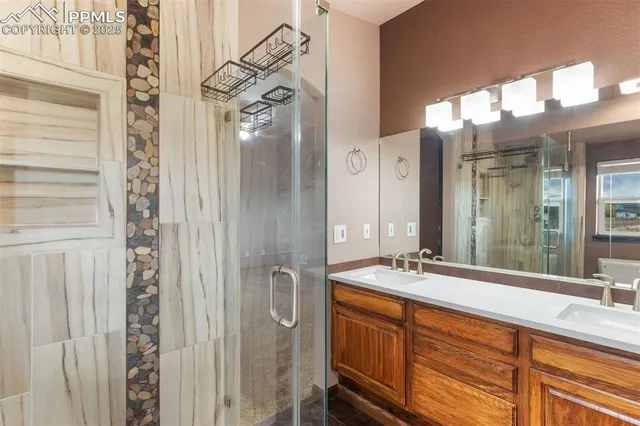 a bathroom with a double vanity sink and a mirror