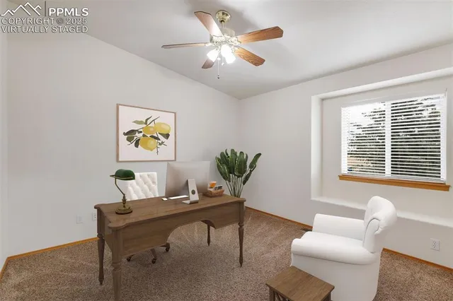 a workspace with furniture and a window