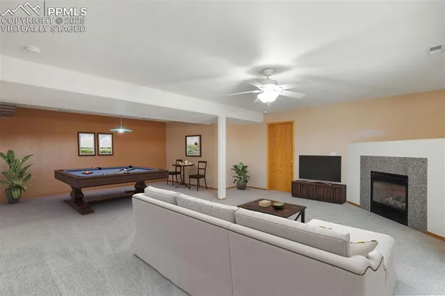 a living room with furniture and a fireplace