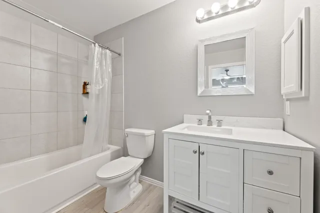 a bathroom with a bathtub and shower