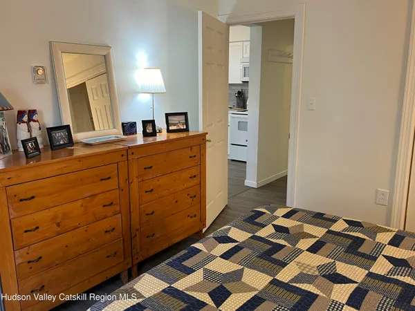 a room with a dresser and a mirror