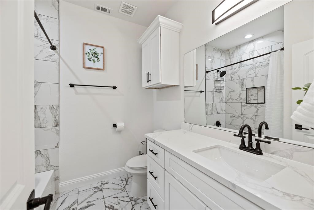 8636 Scott Street, Unit A Houston, TX 77051 - Photo 15 of 21 a bathroom with a sink a toilet and shower