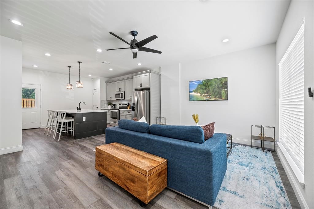 8636 Scott Street, Unit A Houston, TX 77051 - Photo 2 of 21 a living room with furniture and kitchen view