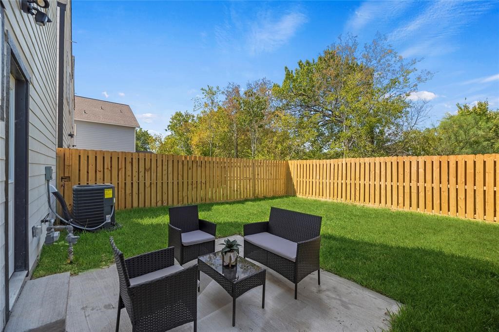 8636 Scott Street, Unit A Houston, TX 77051 - Photo 3 of 21 a view of a chair and table in the garden