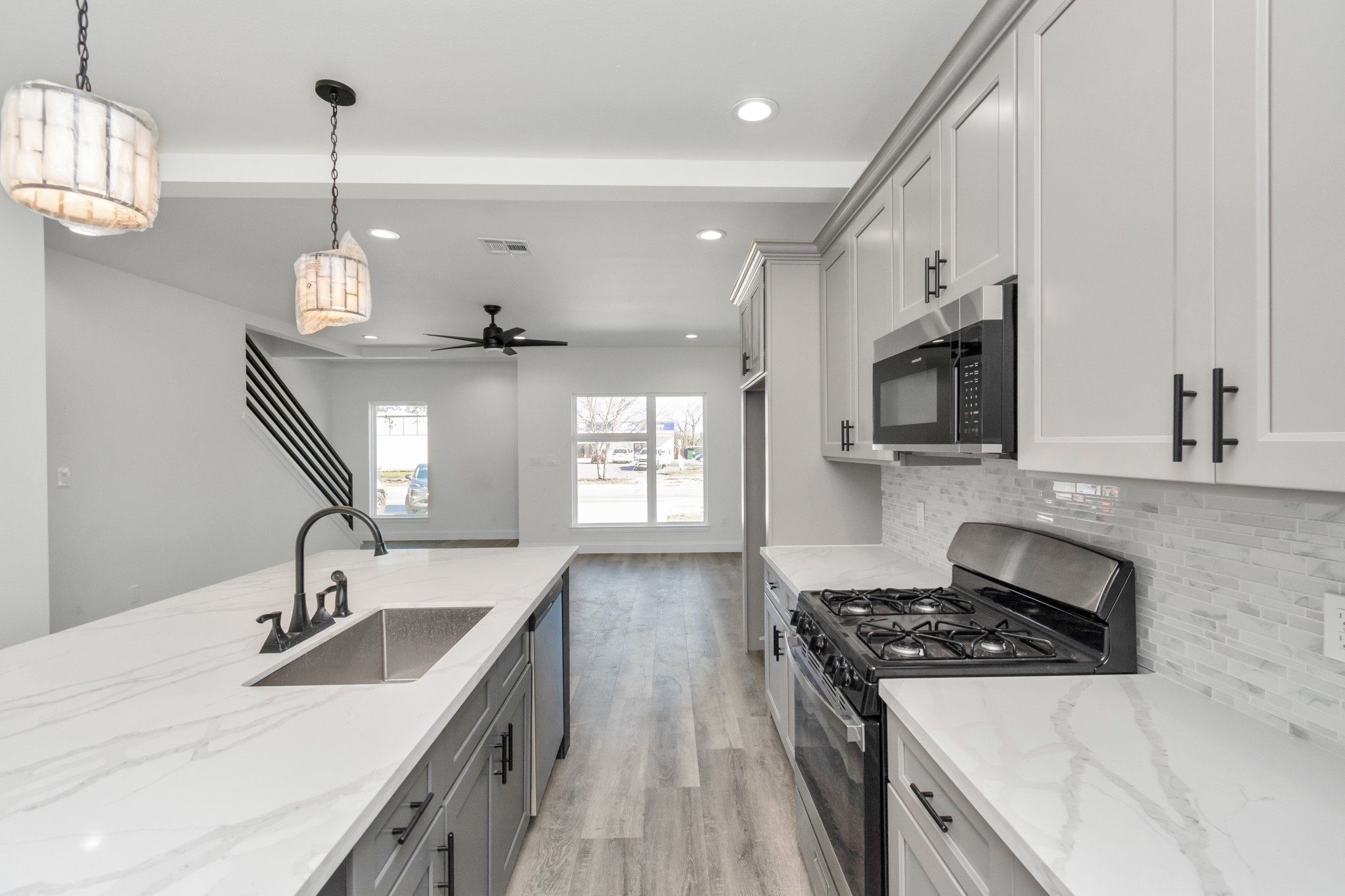 8636 Scott Street, Unit A Houston, TX 77051 - Photo 5 of 21 a kitchen with stainless steel appliances granite countertop a sink stove and refrigerator