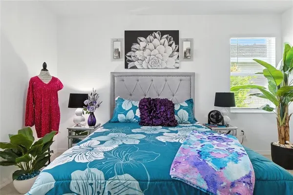 a bedroom with a bed and a window