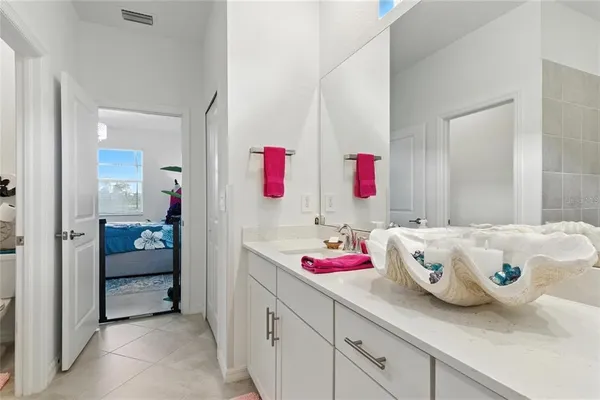 a bedroom with furniture and a bed