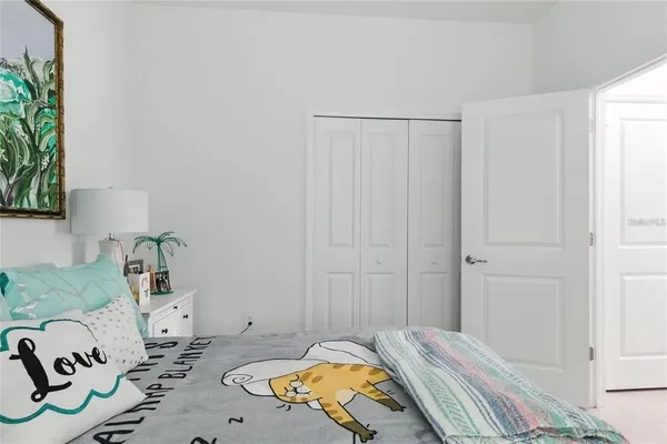 a bedroom with a bed and a dresser