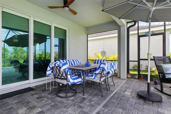 a view of a dining room with furniture window and outside view