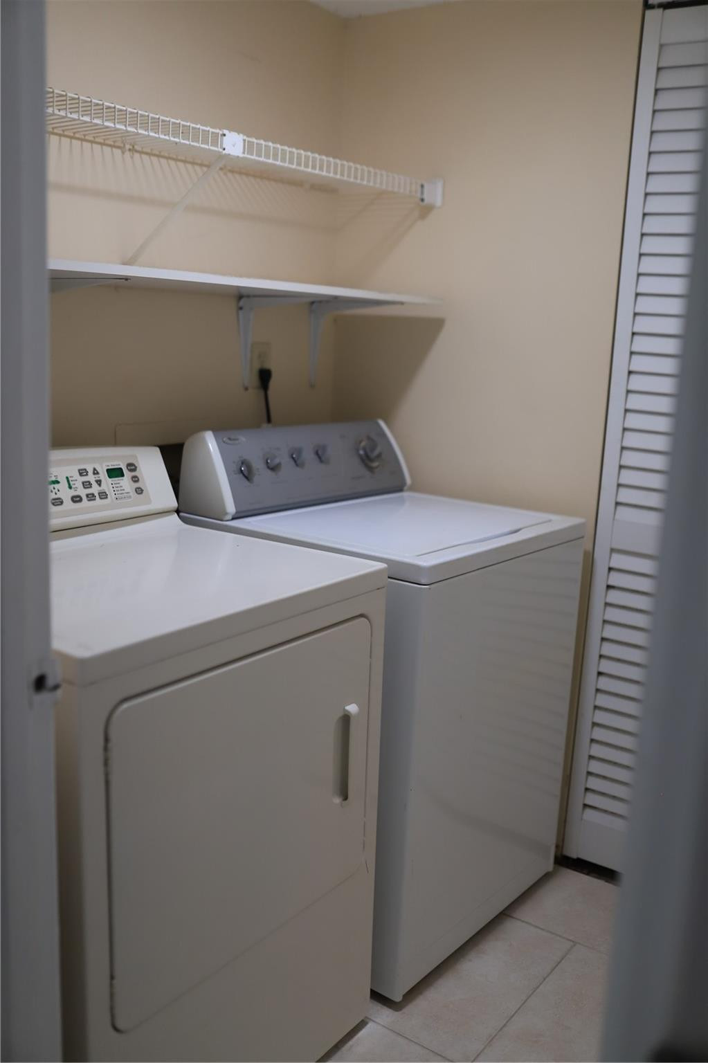 231 Southwest 113th Way, Unit 231 Pembroke Pines, FL 33025 - Photo 11 of 26 a utility room with dryer and washer