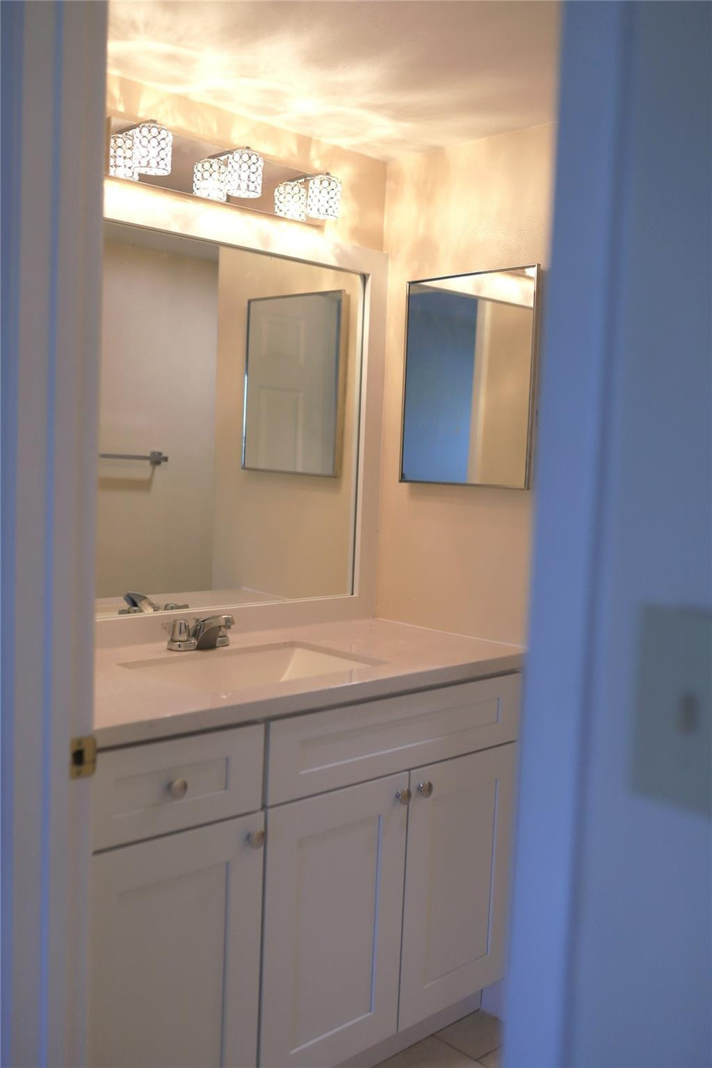 231 Southwest 113th Way, Unit 231 Pembroke Pines, FL 33025 - Photo 12 of 26 a bathroom with a sink and a mirror