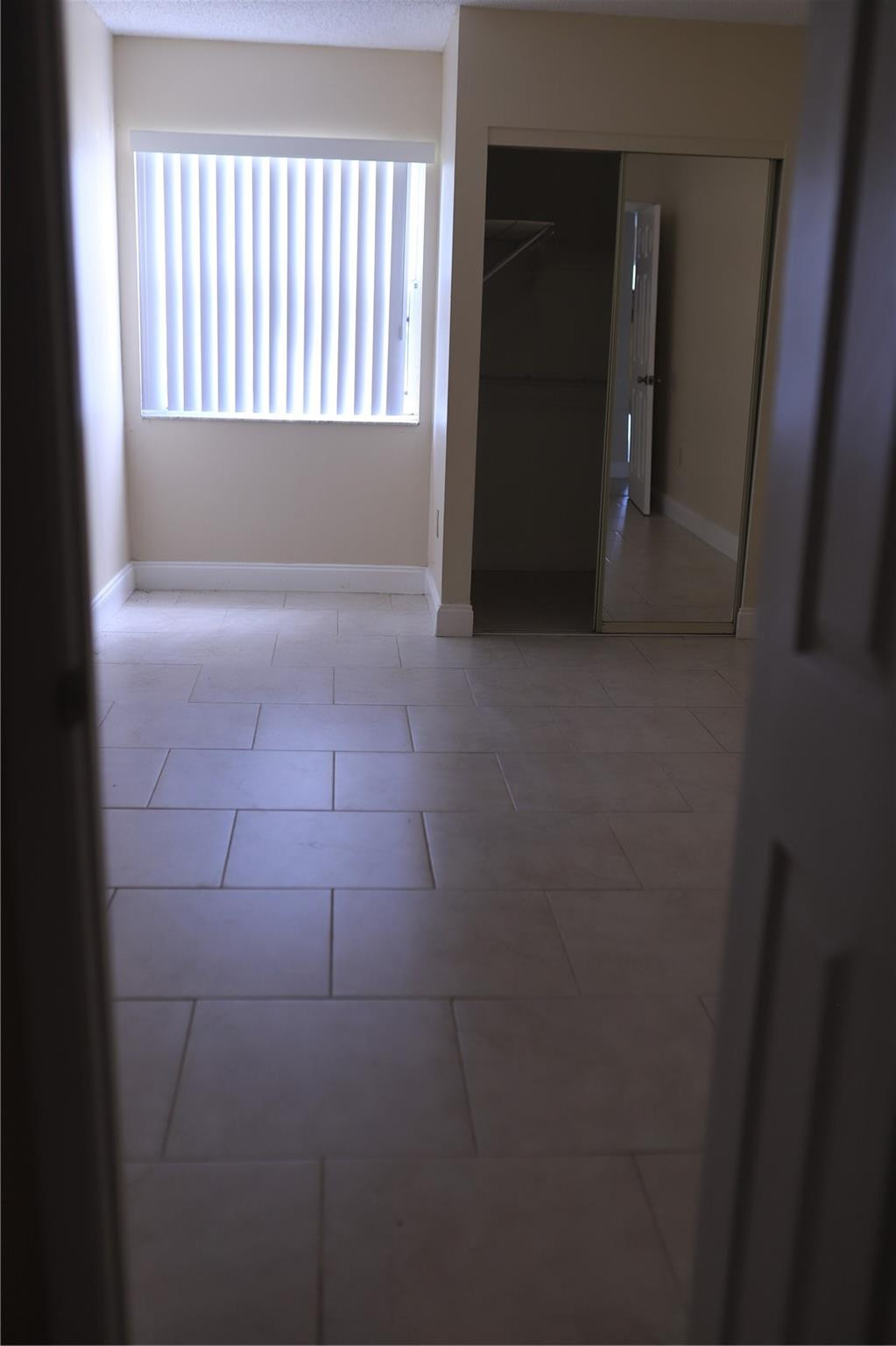 231 Southwest 113th Way, Unit 231 Pembroke Pines, FL 33025 - Photo 17 of 26 a view of wooden floor and windows in a room